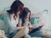 mom-and-daughter-read-on-a-tablet-together