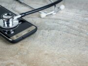 Why Are Health Apps So Costly to Build? a-phone-with-a-stethoscope-on-top-of-it